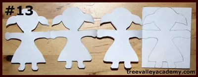 Cutting out one layer at a time of a 4 row 4 column paper doll chain. A fun art project to do with kids.