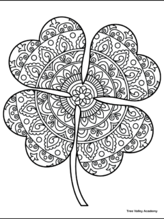 free printable 4 leaf clover coloring page with a zentangle pattern featuring floral, paisley, and decorative circular elements