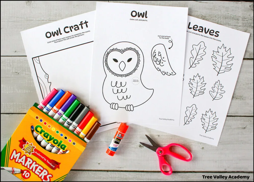 Supplies needed for fall owl cut and paste craft for kids. Materials include markers, a glue stick, a pair of scissors, and 3 printable pages: a leaf coloring page, a tree and nature background coloring page and an owl cut and paste coloring page.