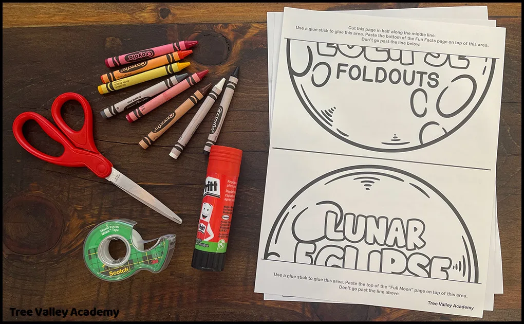 Supplies needed for the lunar eclipse craft: 3 page printout, crayons, scissors, tape, and a glue stick.
