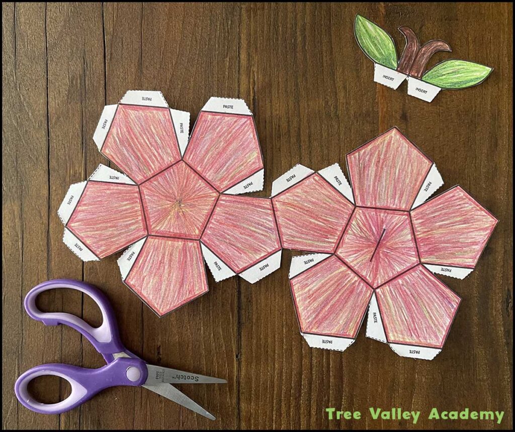 Cut-out pieces of the colored 3D apple craft template