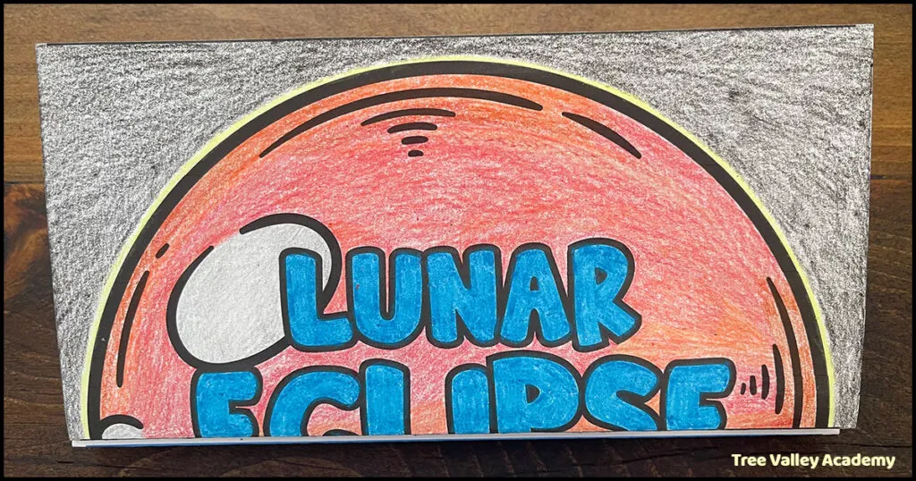 The finished lunar eclipse craft is small when folded together.